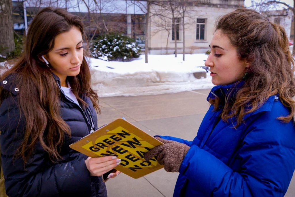 Member of the Sunrise Movement getting someone to Sign Up to Vote
